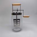 Hand butter blender vintage in a classic glass bottle with a wood handle for homemade butter.